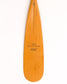 a beavertail canoe paddle that has a light colored blade and a light cherry inlay for the grip and shaft. made with BC fir and walnut and cherry hardwood. the picture shows a detail of the grip and blade