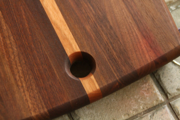 Walnut and cherry cutting board with curved edges, 18" x 10"